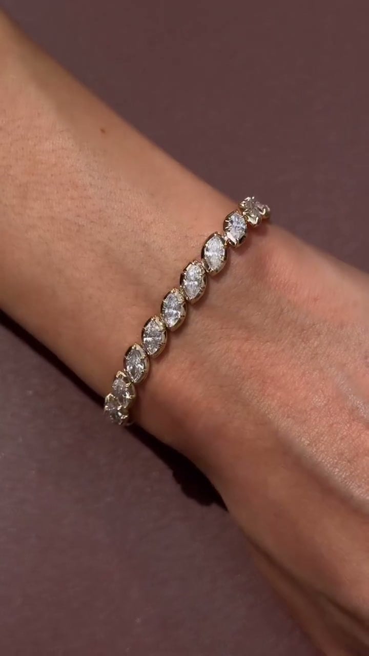 Marquise-shaped linked bracelet worn around a wrist, with each pointed oval setting visible.